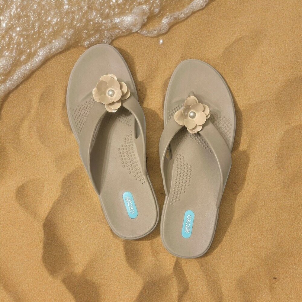 NWOB Oka B Women's size Large Flip Flops Gold Tan Rubber With Flower ($52)